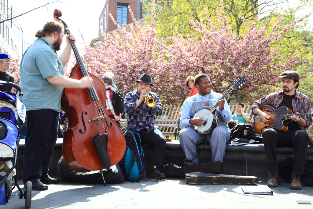 Bluegrass musicians playing together outdoors