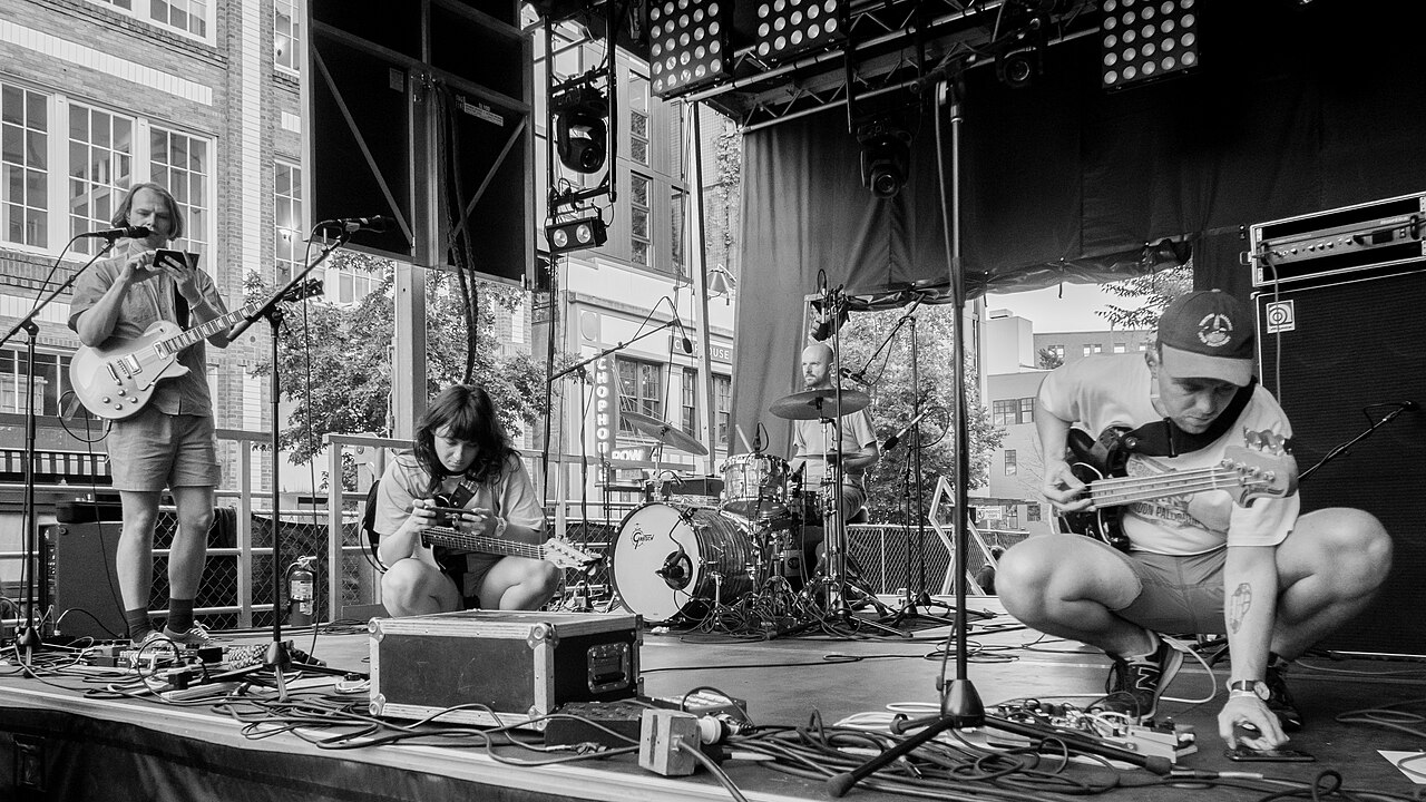 Band checking instruments and microphones before a show