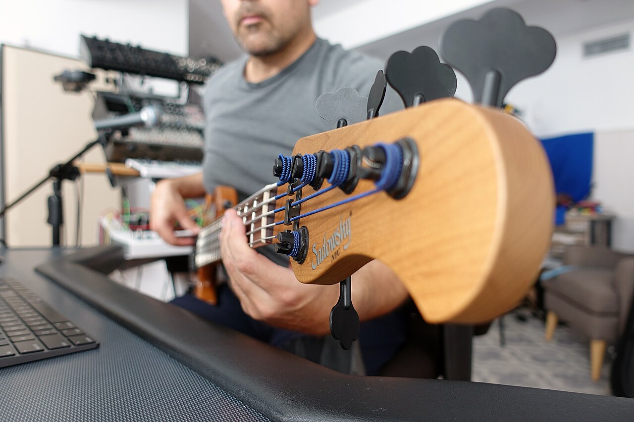 Bassist playing a five-string instrument